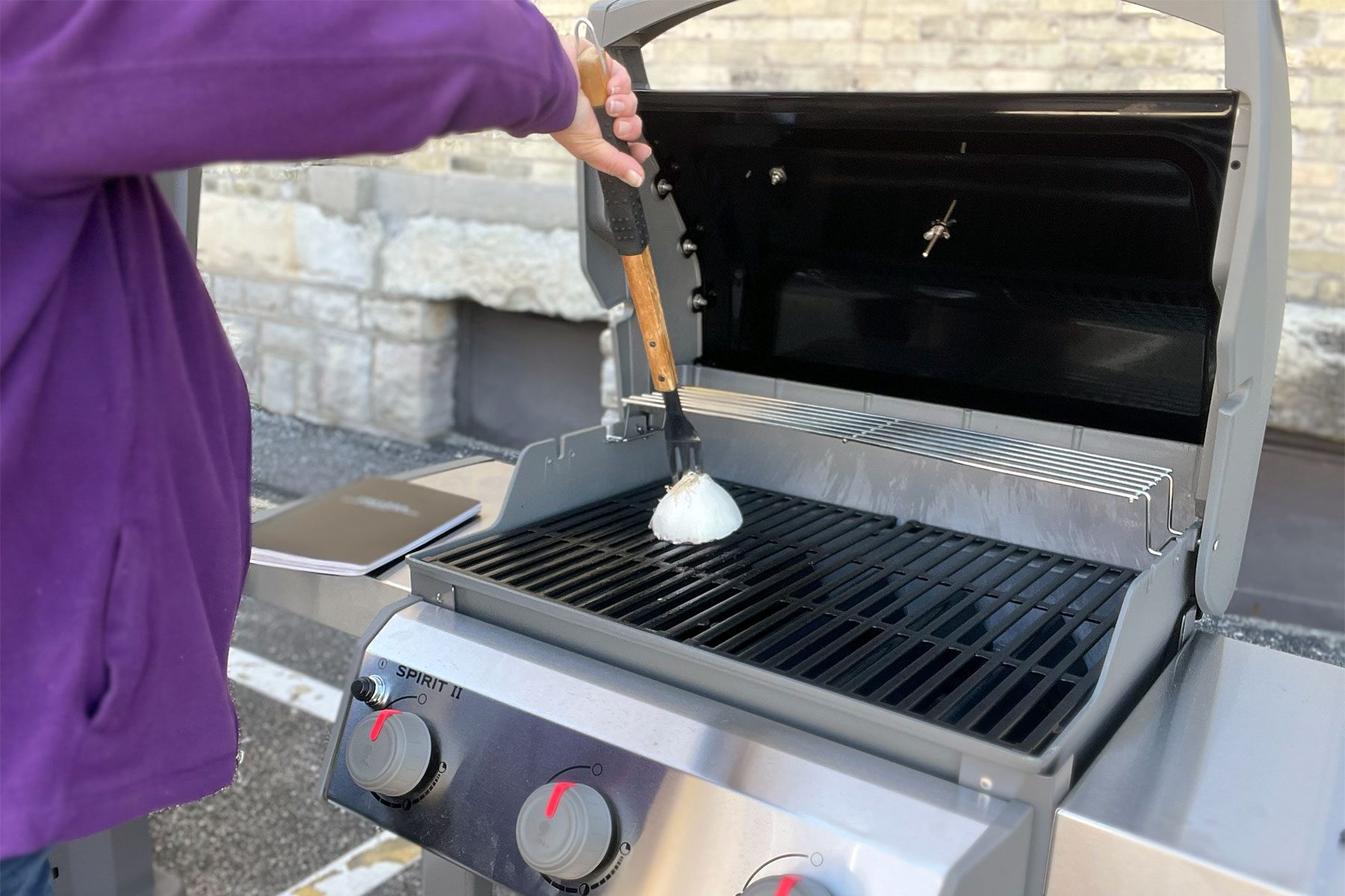 Rubbing Onion on Griller