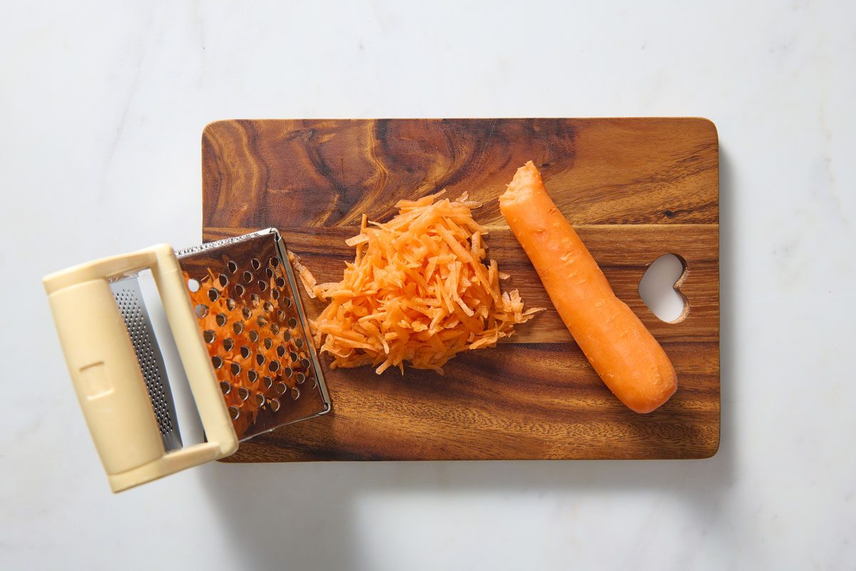 Shredded Carrot On A Chopping Board