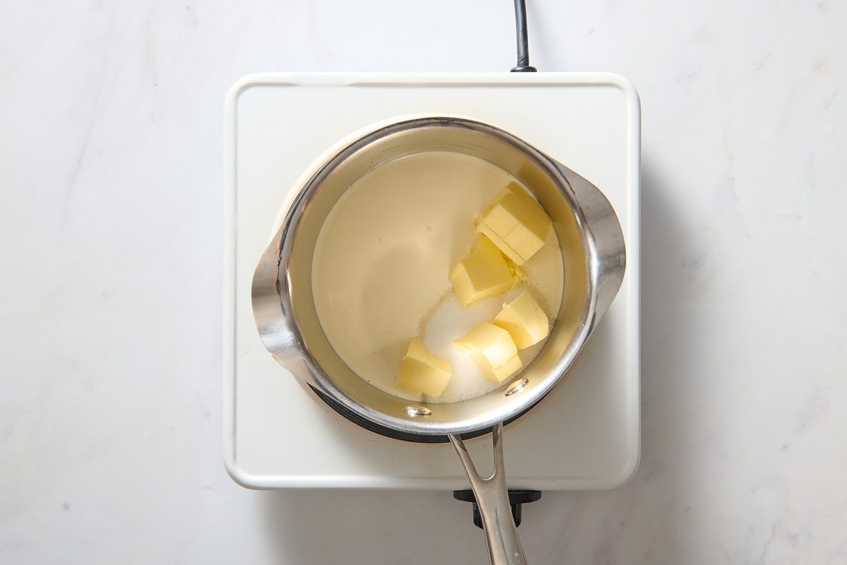 Heating the ingredients for the fudge sauce in a pan