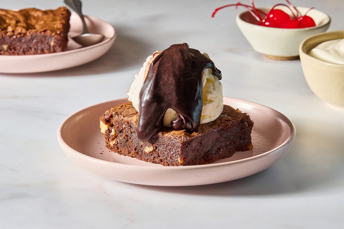Chocolate brownie sundae made with vanilla ice cream and hot fudge sauce