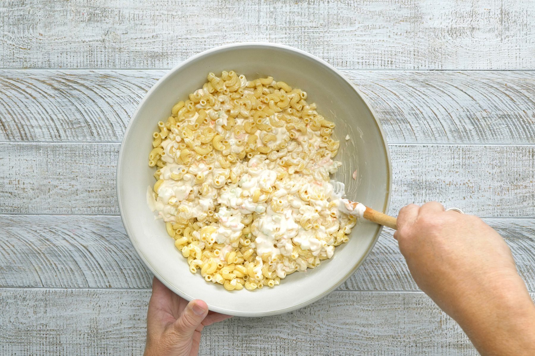 Gently toss the dressing and the macaroni