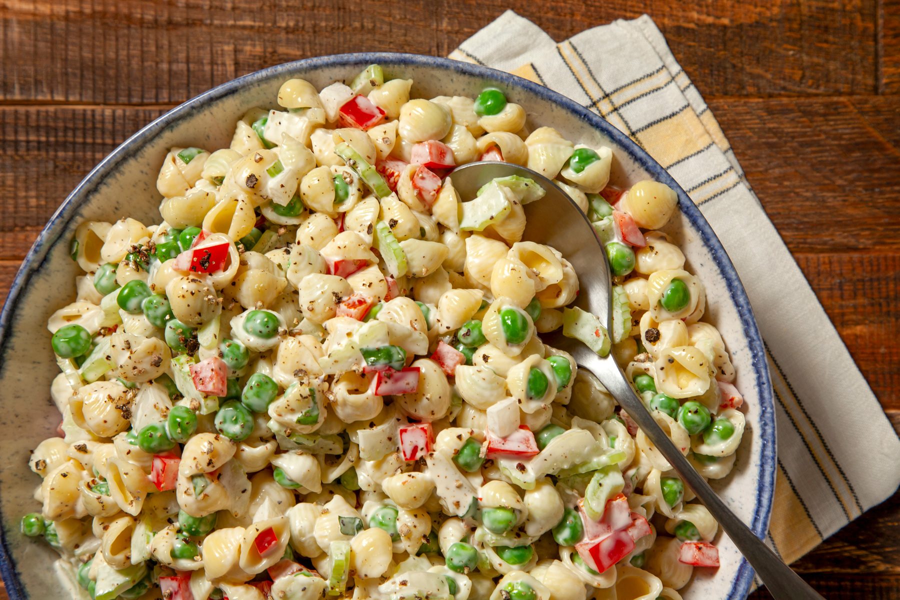 Pasta Salad With Peas, pepper and onion served in a plate