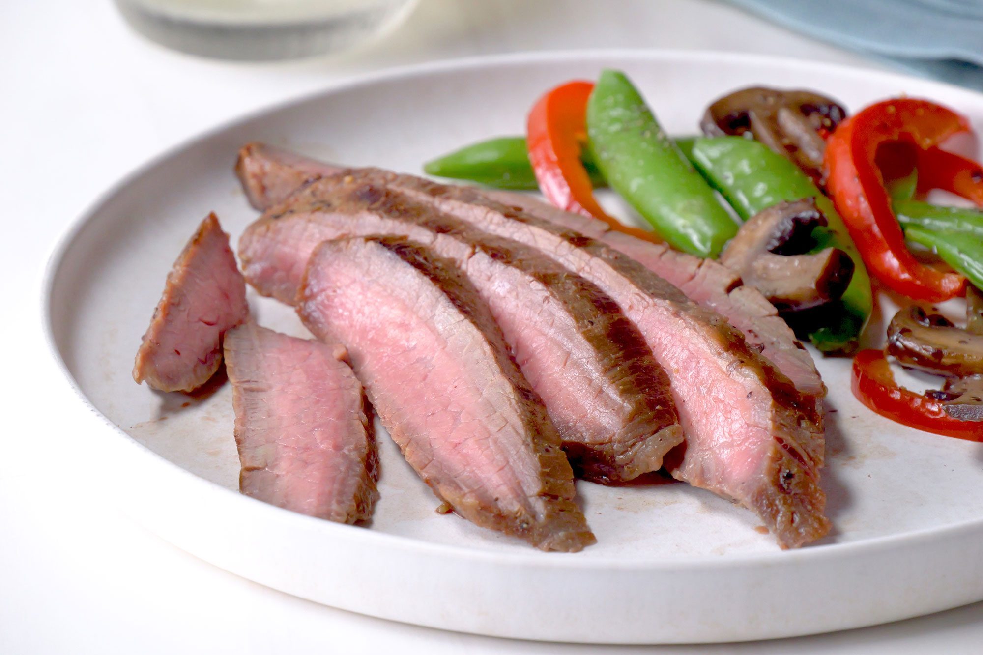 A delicious plate of Soy Marinated Flank Steak with vegetables