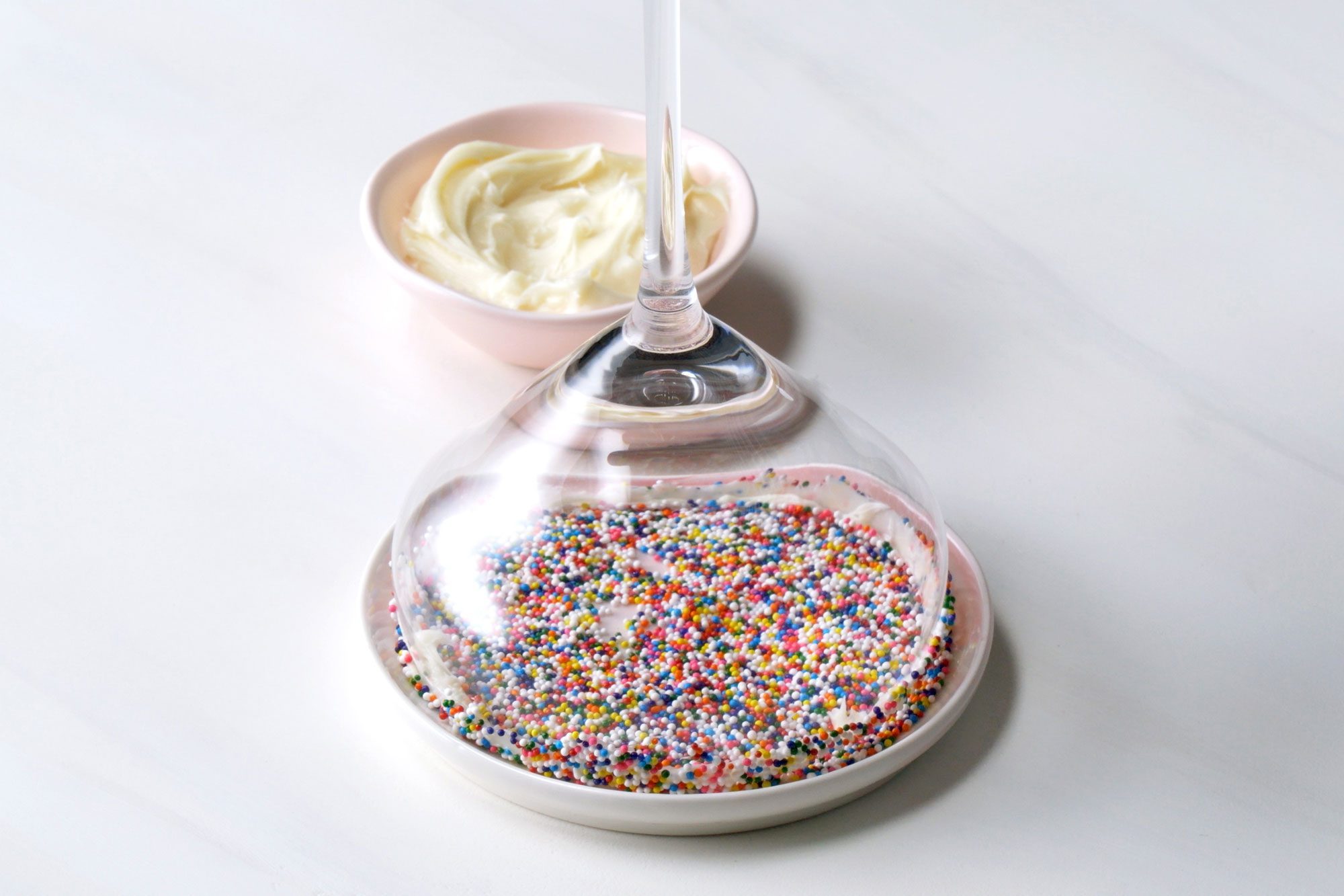 Place your Christmas sprinkles on a plate, then dip the rim of glass
