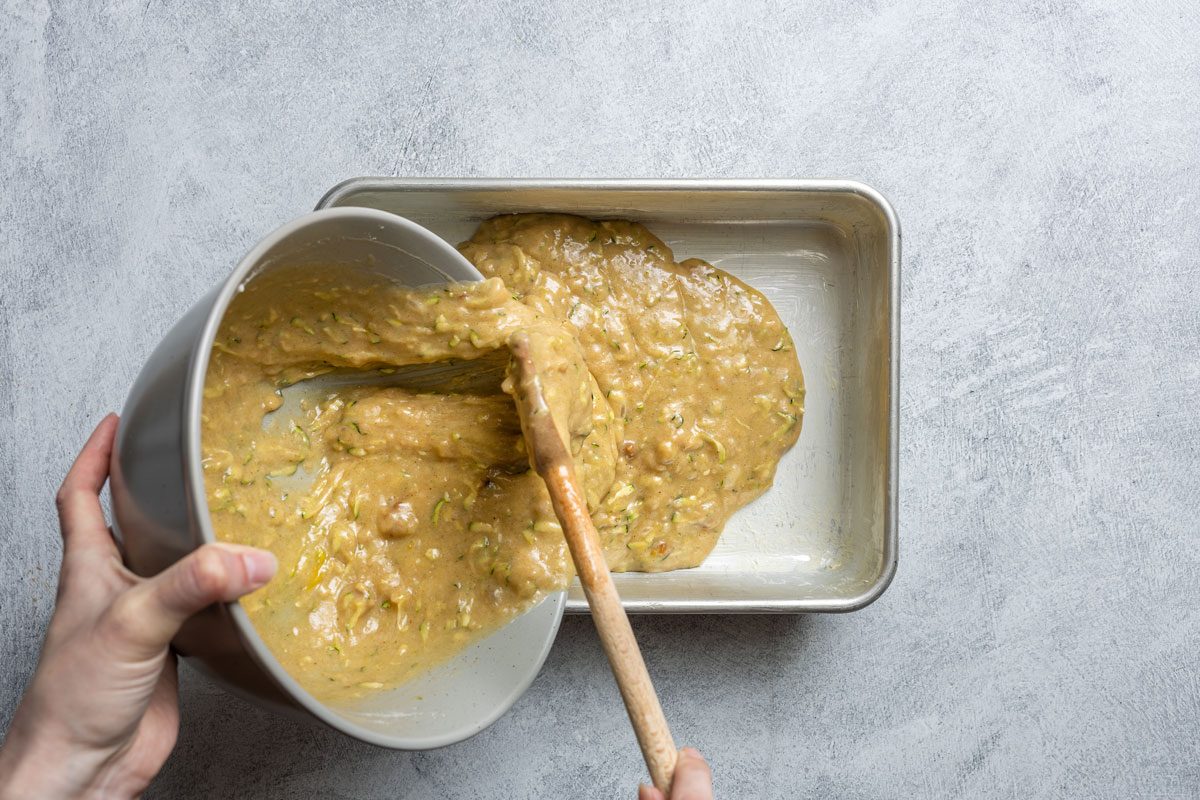 Poring Zucchini Cake Batter In The Mold