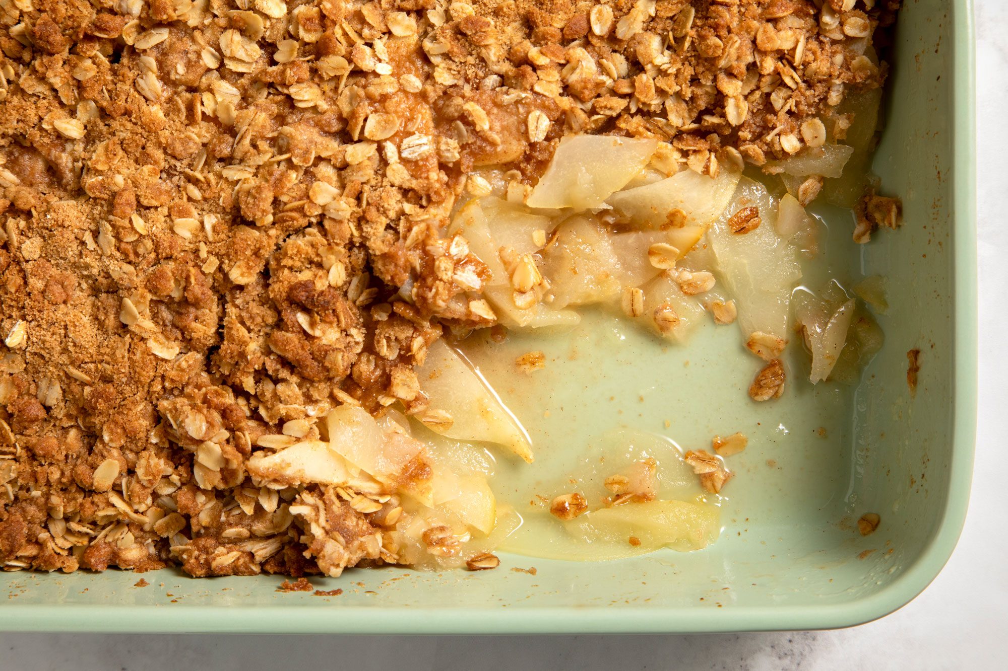 overhead shot; close shot; white background; Easy Apple-Pear Crisp in a baking dish;