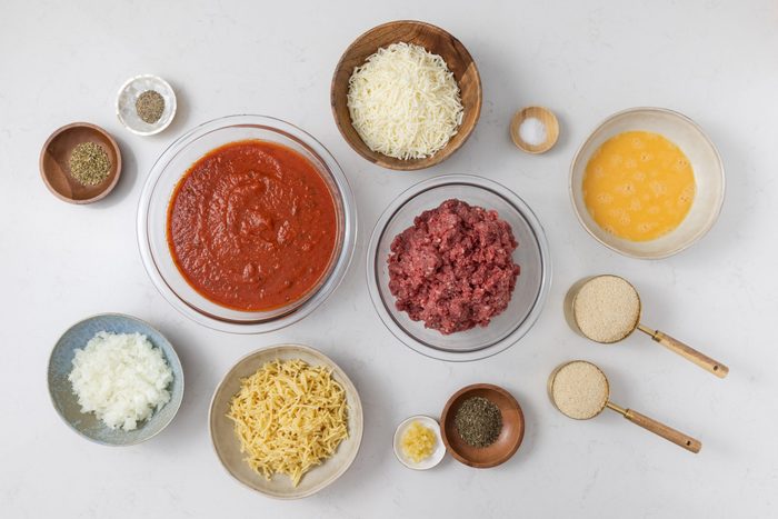 Ingredients for baked spaghetti and meatballs on kitchen counter.