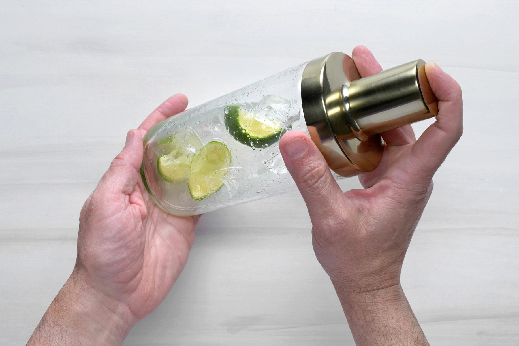 Add ice cubes and shake the cocktail mixture well