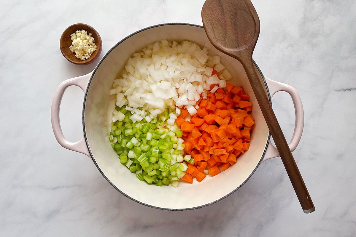 Step 1 for cooking Taste of Home's Chicken Cabbage Soup is sauteeing onion, celery and carrots in a dutch oven