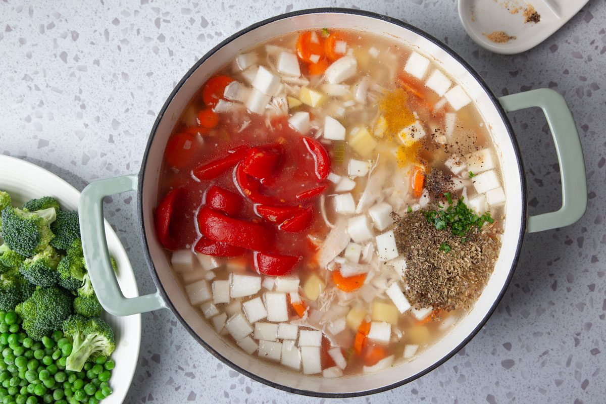 Step 3 of Taste of Home Chicken Vegetable Soup is adding the remaining vegetables to the broth, adding the broccoli and peas last