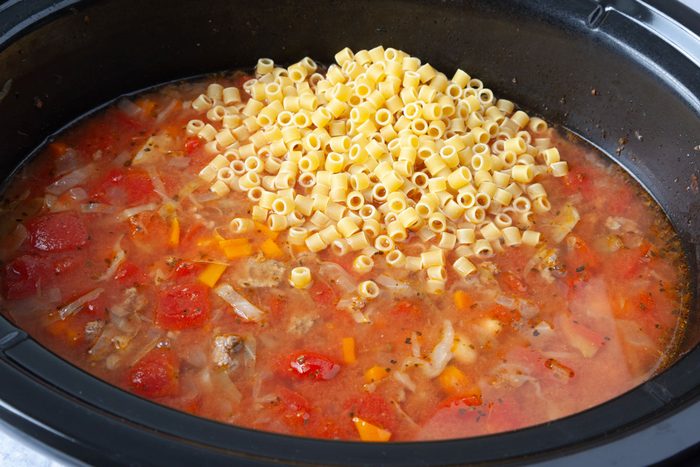 Step 3 of Taste of Home Crockpot Pasta Fagioli is adding the ditalini pasta to the soup to cook