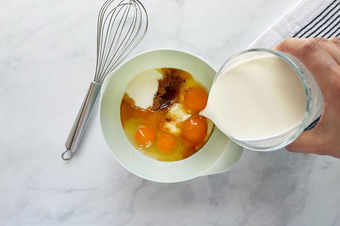 How to make Taste of Home's Baked Egg Custard, step 1 is mixing eggs, sugar and milk together