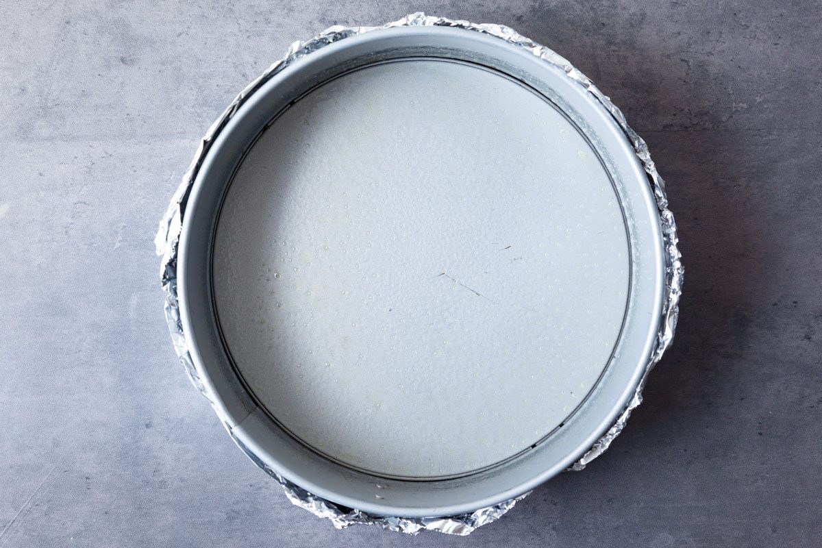 Step 1 of Taste of Home Eggnog Cheesecake is to wrap the pan in a double thickness of foil to create a water barrier