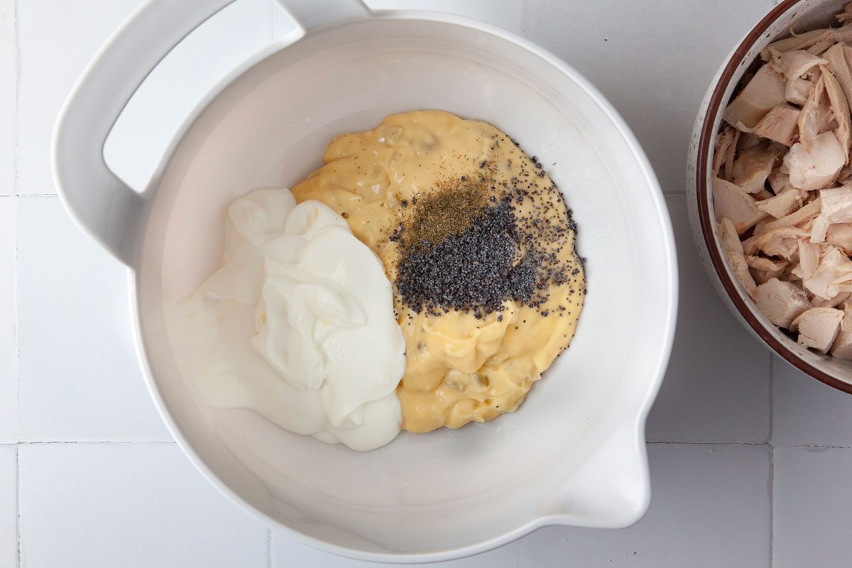 Step 1 of Taste of Home Poppy Seed Chicken is to mix the soup, sour cream, poppy seeds and dill weed together before adding the chicken and rice