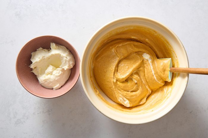 Folding whipped topping into the pumpkin mousse mixture