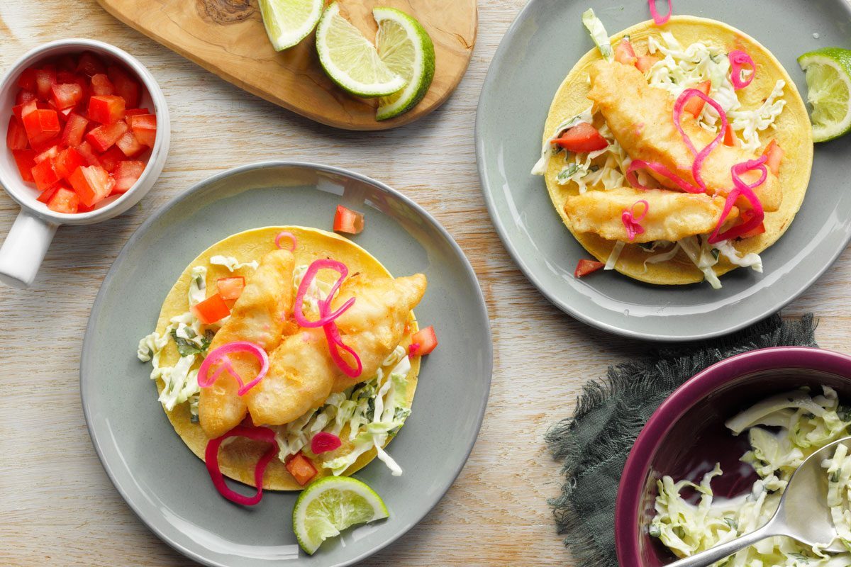 Beer Battered Fish Tacos served on two plates