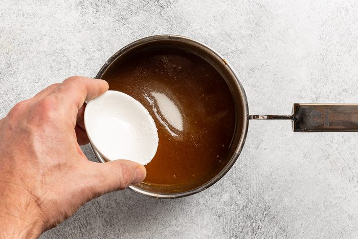 Taste of Home Apple Syrup recipe photo of adding the sugar substitute to the saucepan.