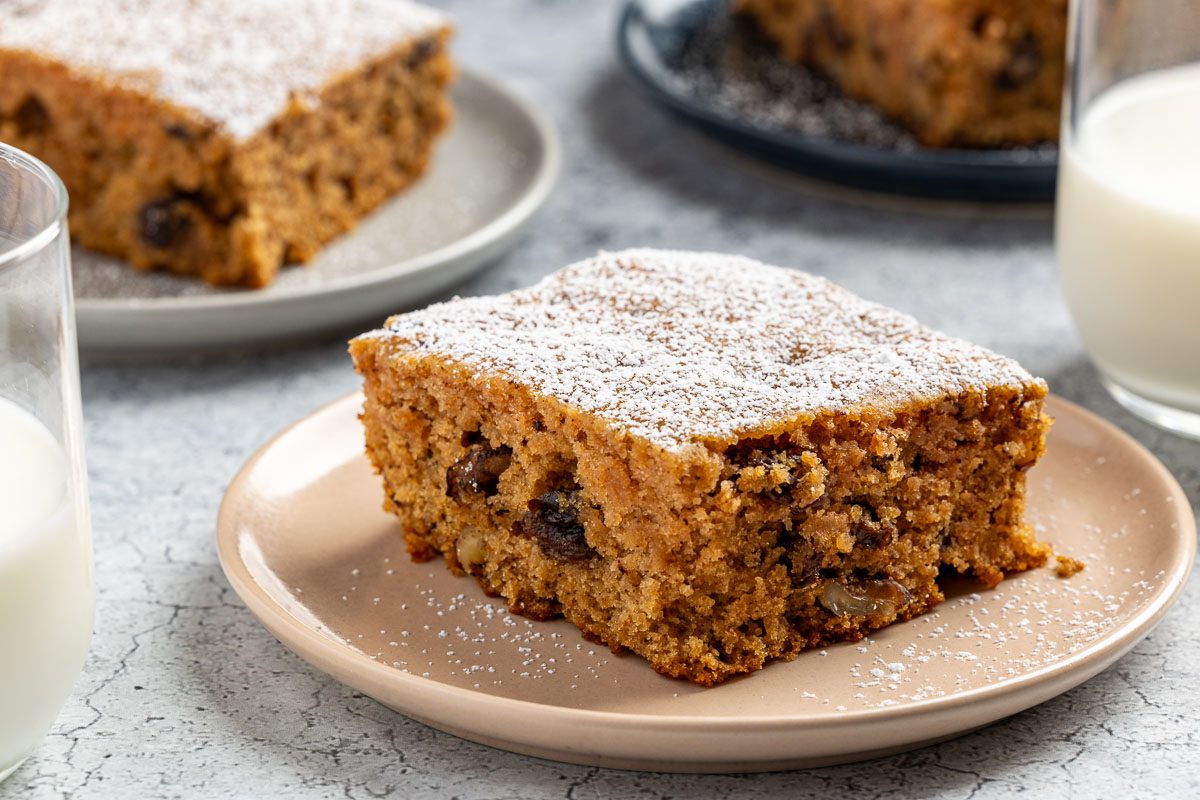 Taste of Home Applesauce Cake photo of the finished recipe cut into slices and placed on plates.