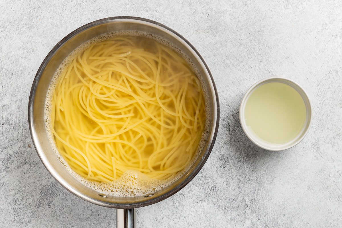 Taste of Home Avocado Pesto recipe photo of the cooked pasta with a half cup of the water reserved.