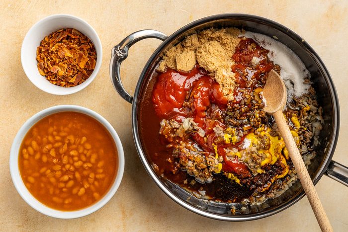 Taste of Home BBQ baked beans recipe photo of the rest of the ingredients added to the skillet.