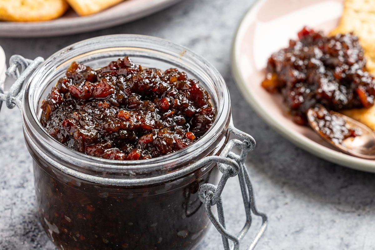 Taste of Home Bourbon Bacon Jam recipe photo of the finished recipe served with crackers.