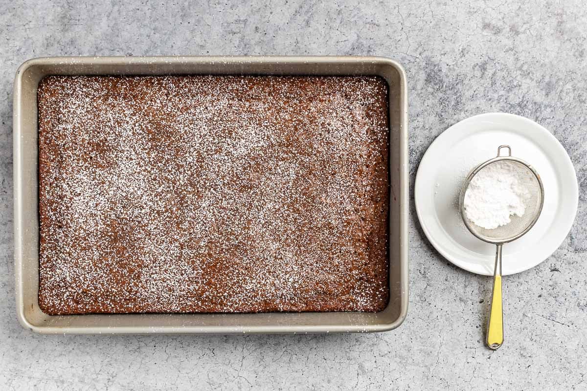 Taste of Home Chewy Brownie Recipe photo of the baked brownies dusted with confectioners sugar.
