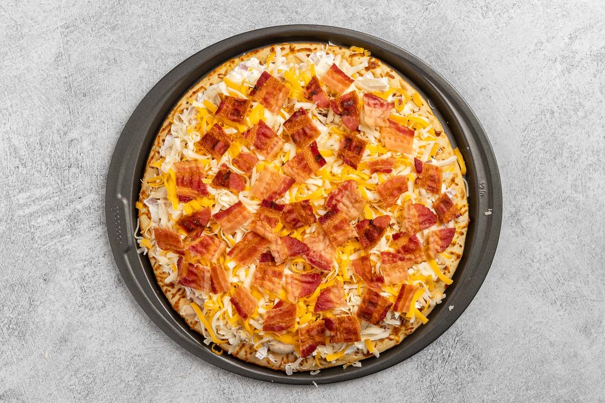 Taste of Home Chicken Bacon Ranch Pizza recipe photo of the pizza fully assembled and ready for baking.