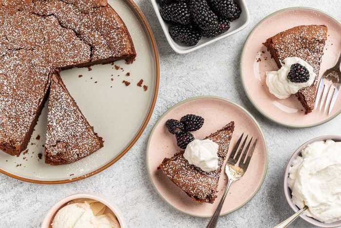 Taste of Home Chocolate Olive Oil Cake recipe photo of the finished recipe cut into slices and served on plates.