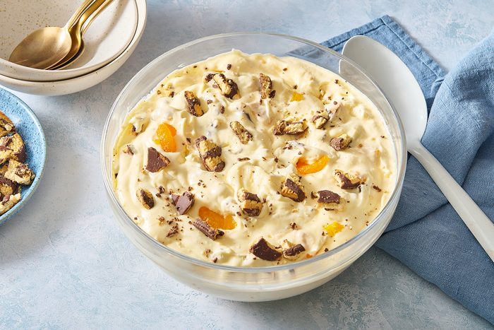 Cookie salad served in a large bowl and topped with crumbled fudge cookies and mandarin oranges