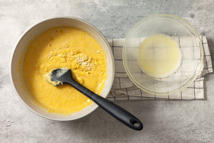 Top view shot of mixing wet and dry ingredients