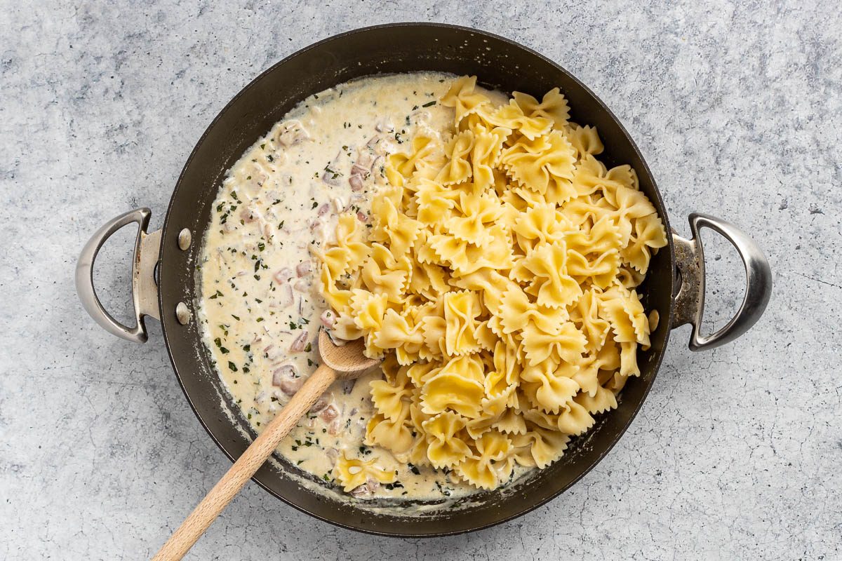 Taste of Home Cream Sauce for Pasta recipe photo of the cooked pasta added to the cooked and reduced cream sauce.