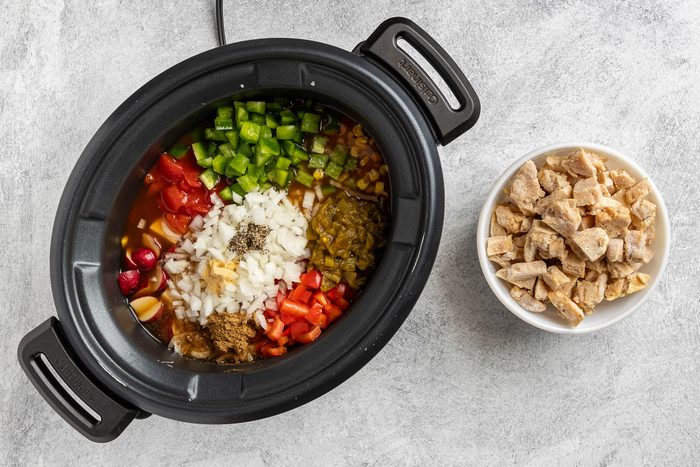 Taste of Home Crockpot Chicken Vegetable Soup recipe photo all the ingredients, except the spinach, added to the crockpot.