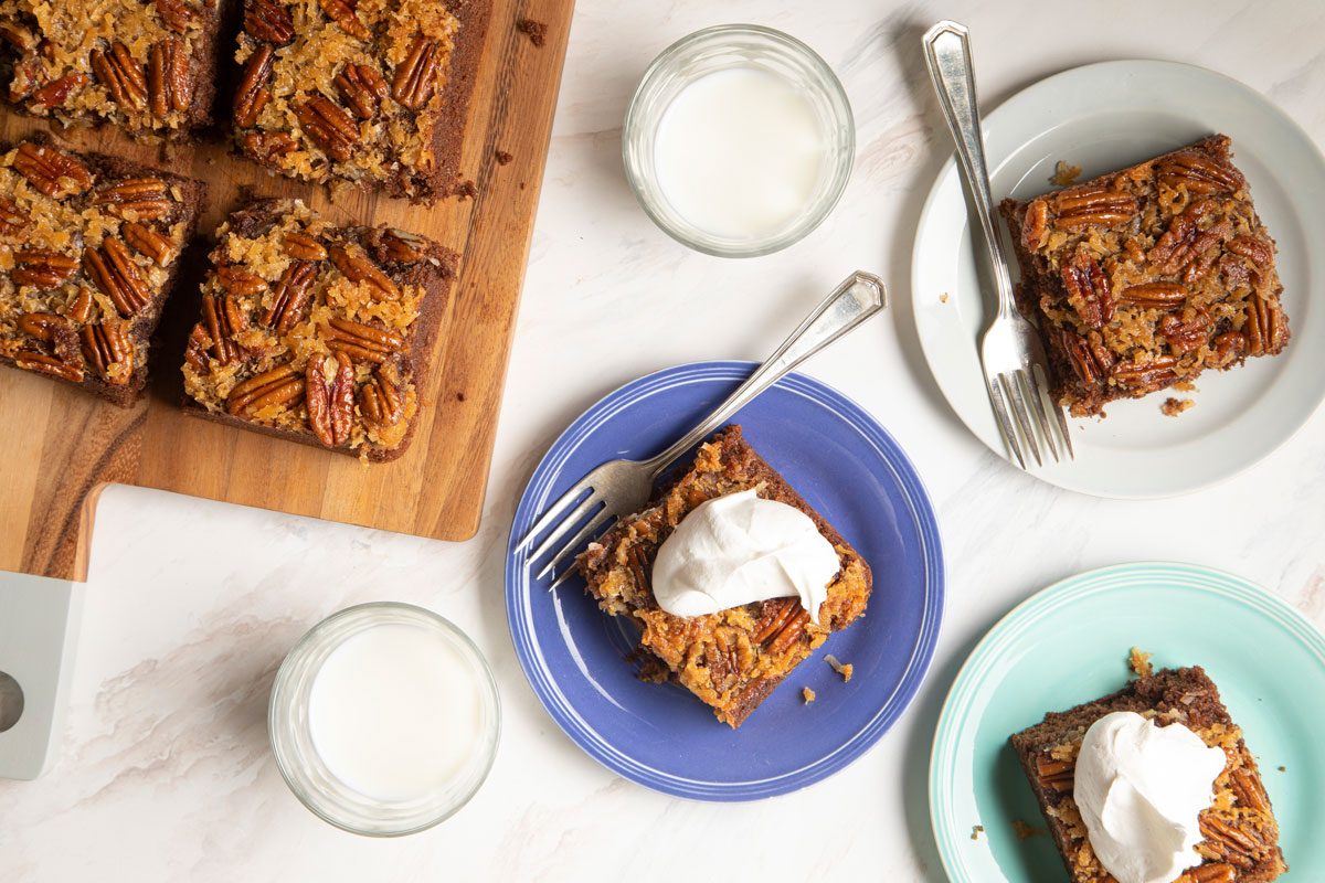 German Chocolate Upside Down Cake slices served on two plates 