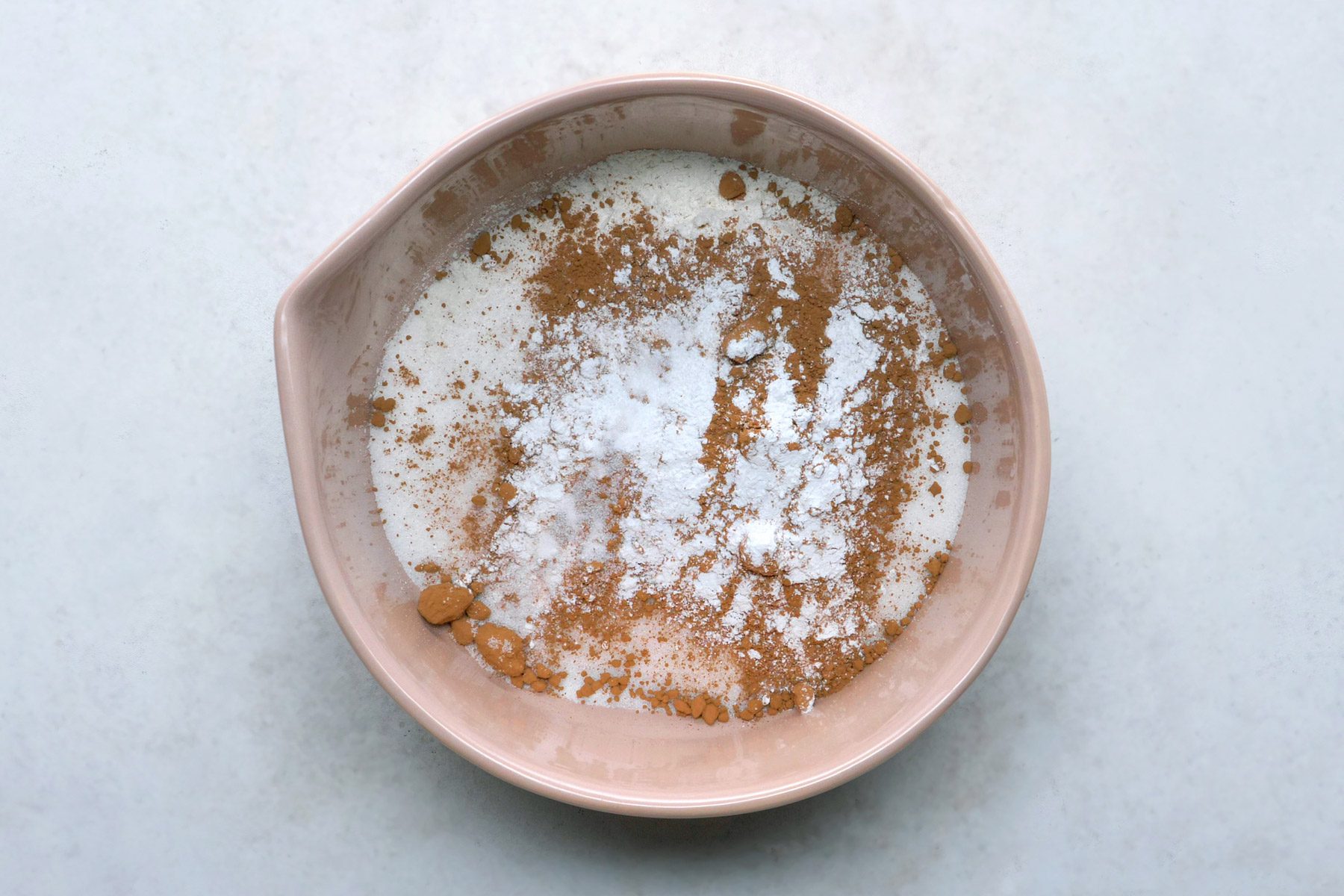 All-purpose flour, sugar, 2 tablespoons cocoa, baking powder and salt are in a large bowl.