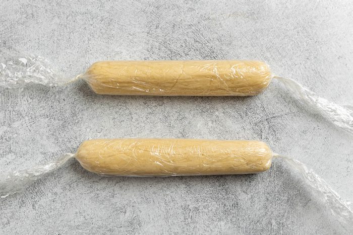 Taste of Home Lemon Meltaway Cookies recipe photo the cookie dough plastic wrapped in into two 8 inch rolls.