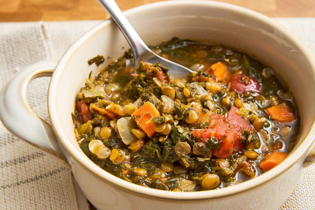 Lentil stew in bowl ready to eat with spoon