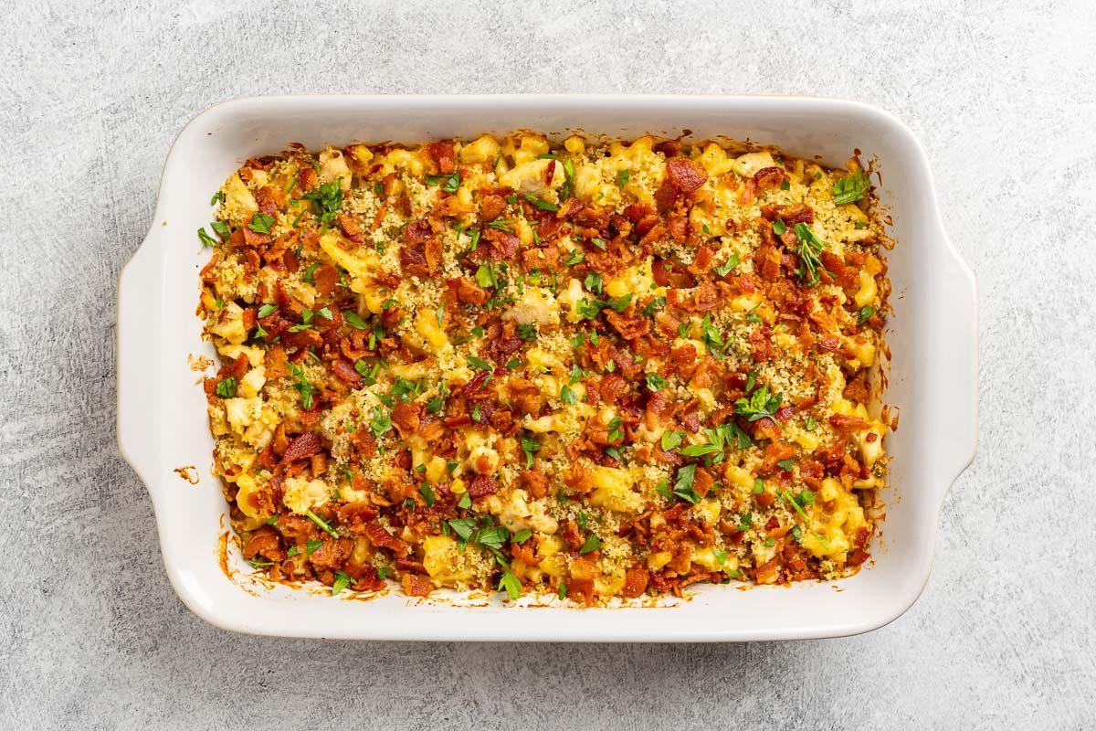 Taste of Home Macaroni and Cheese with Chicken recipe photo of the cooked mac and cheese topped with bacon and parsely.