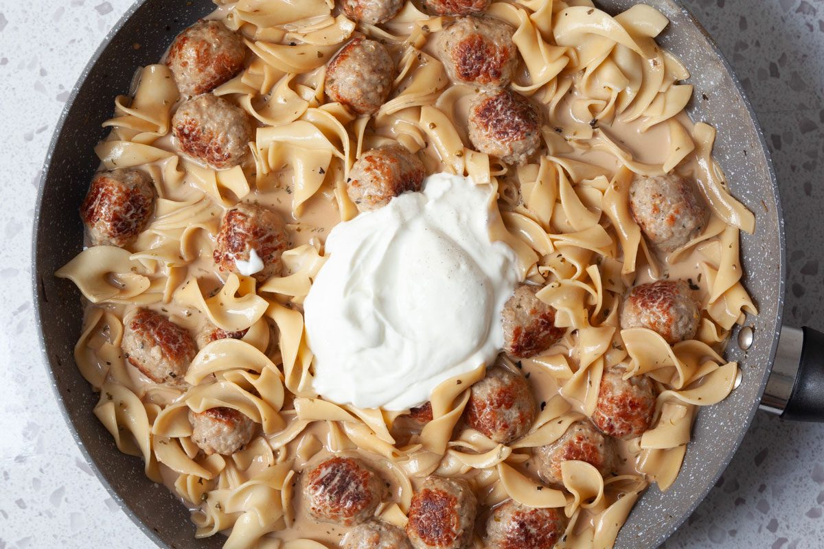Step 5 of Taste of Home Meatball Stroganoff is to add the sour cream and stir to combine