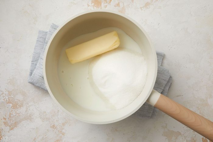 In a saucepan, combine the sugar, butter and milk