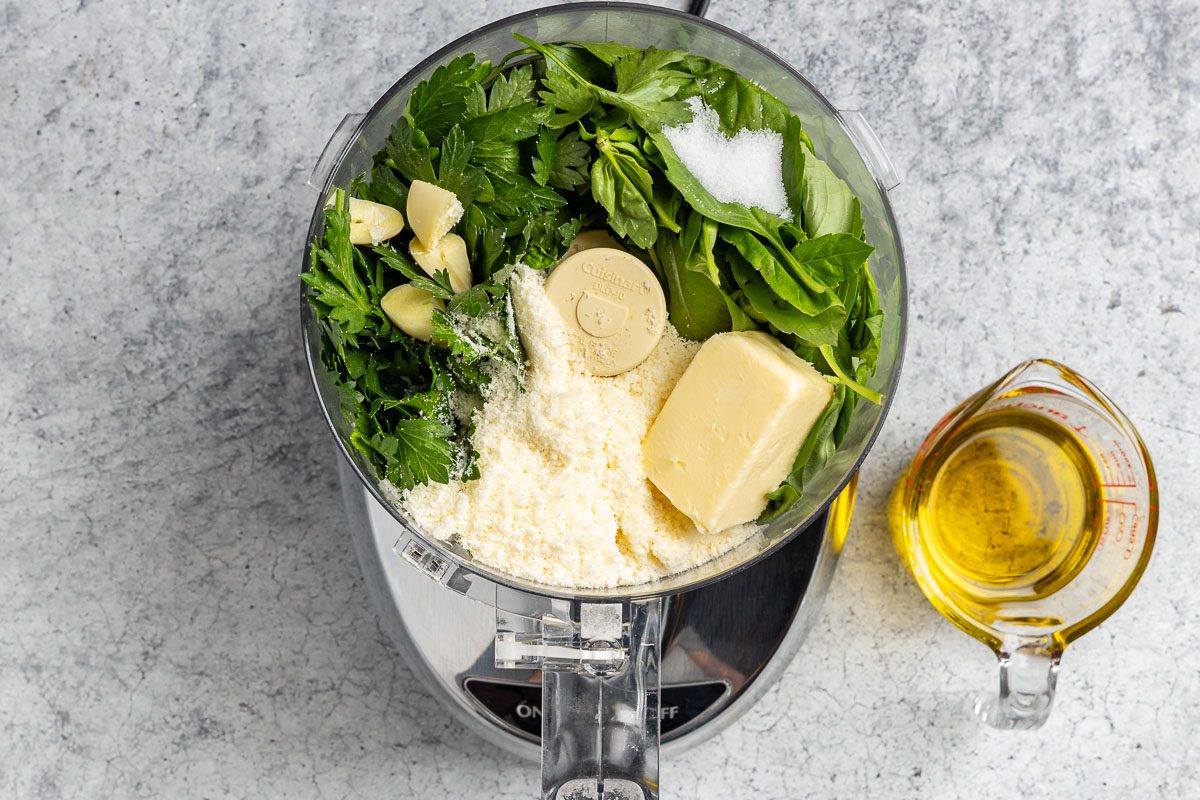 Taste of Home Nut-Free Pesto recipe photo of all the ingredients, except the olive oil, in a food processor.