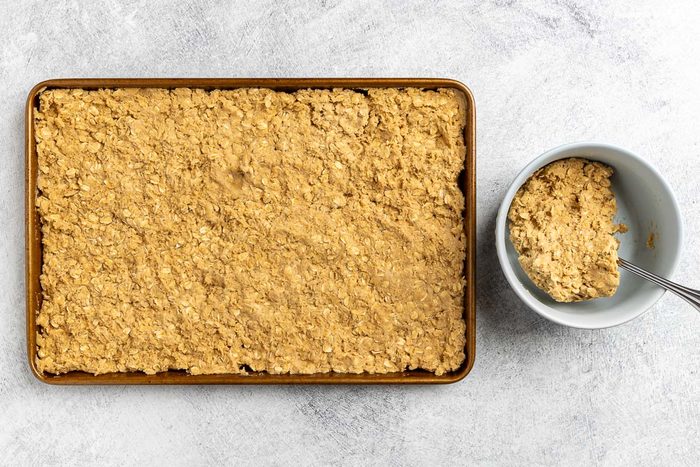 Taste of Home Oatmeal Brownies recipe photo of making the oatmeal brownie layer and setting it into a 15 x 10 x 1 baking sheet.