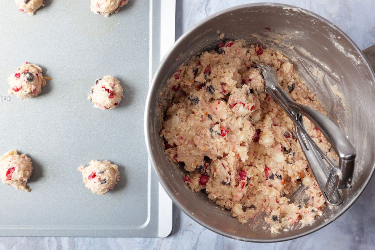 Step 2 of Taste of Home Oatmeal Cranberry Cookies is to scoop the dough 2 inches apart onto a greased baking sheet
