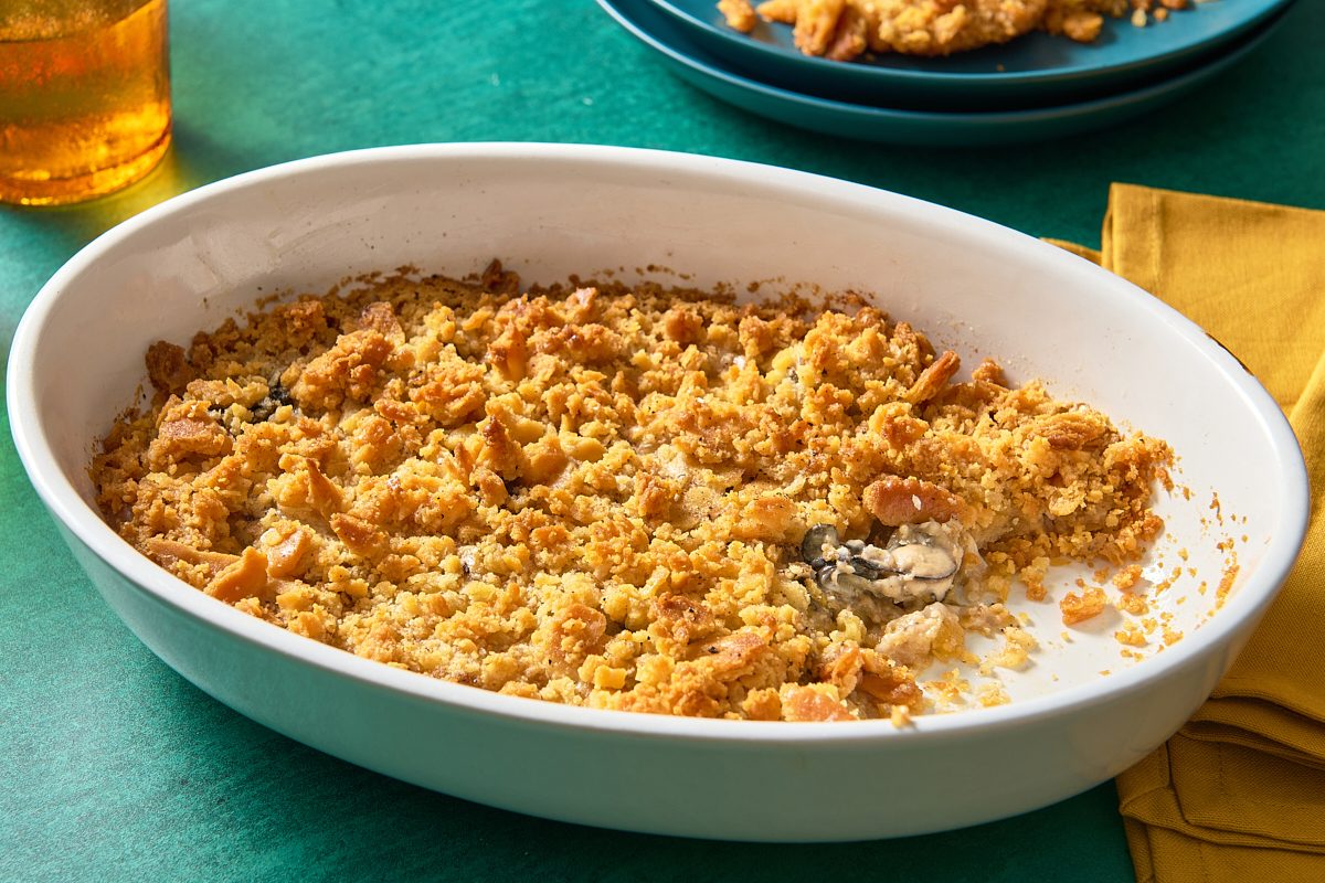 Oyster casserole in a dish with a portion scooped out