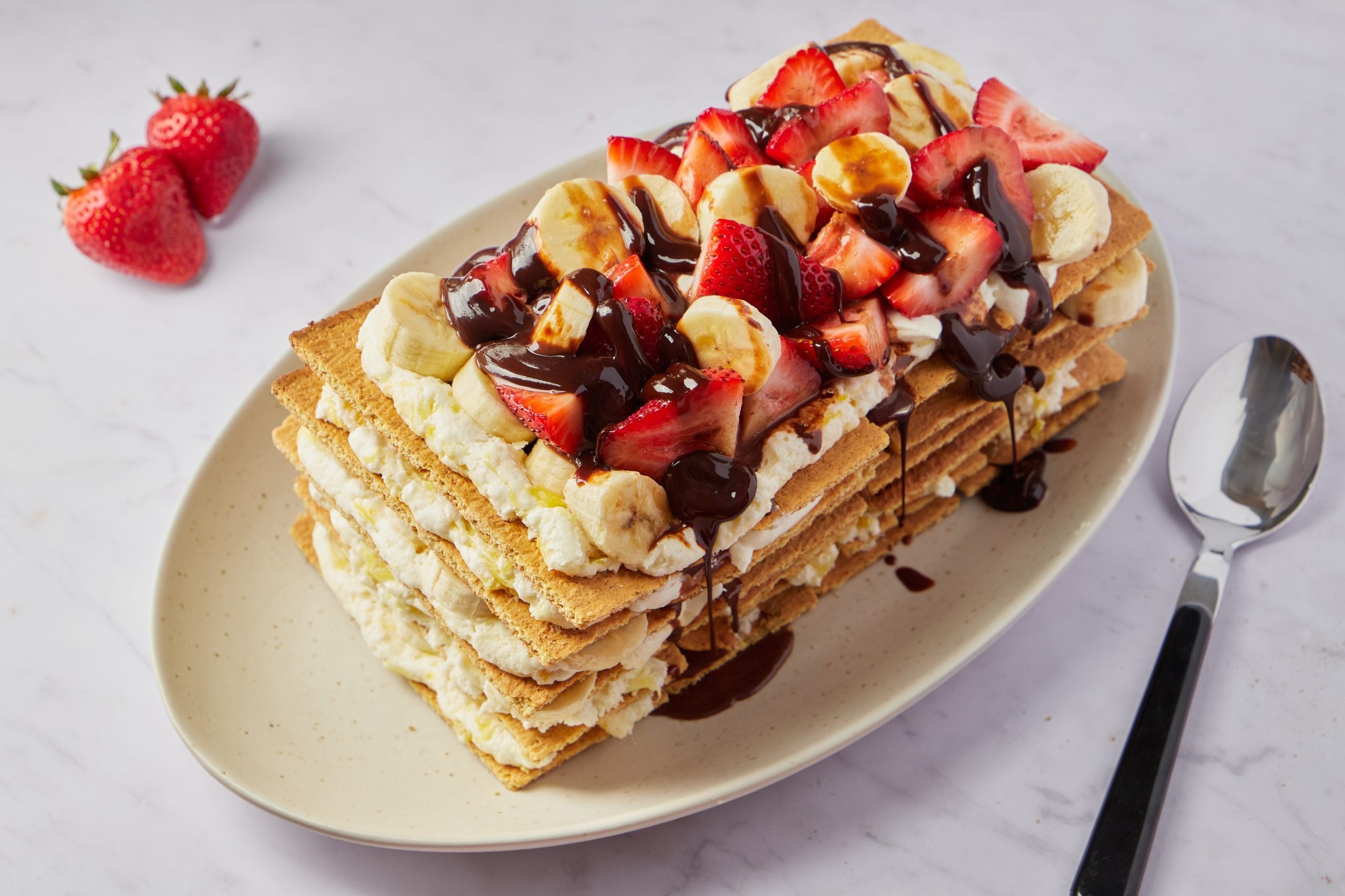This banana split cake takes a twist on the beloved ice cream dessert with a timeless no-bake recipe.
