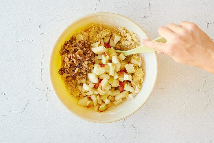 Mix the apple walnut cake batter.