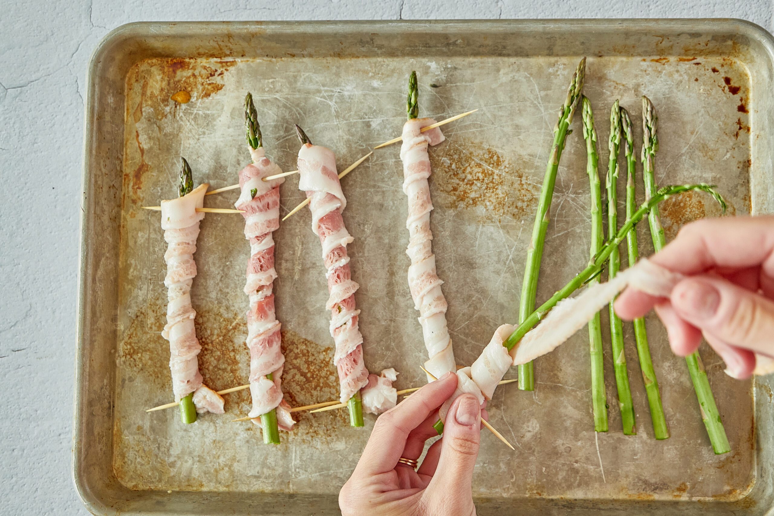 Wrap the asparagus with bacon