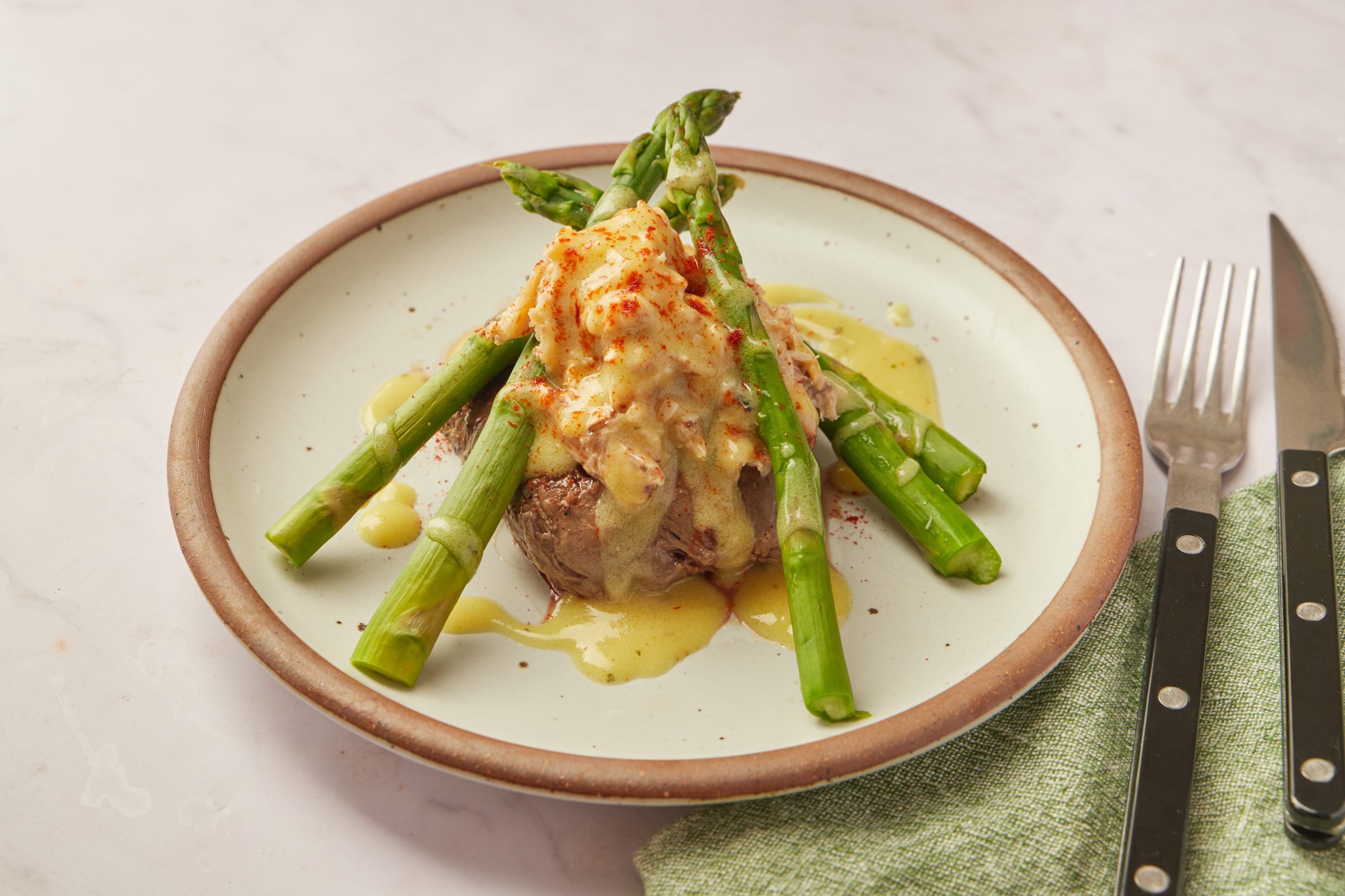 If you like surf 'n' turf, you'll love steak Oscar. It's an amped-up version of surf 'n' turf made with premium ingredients, and this version is quick and easy to make.