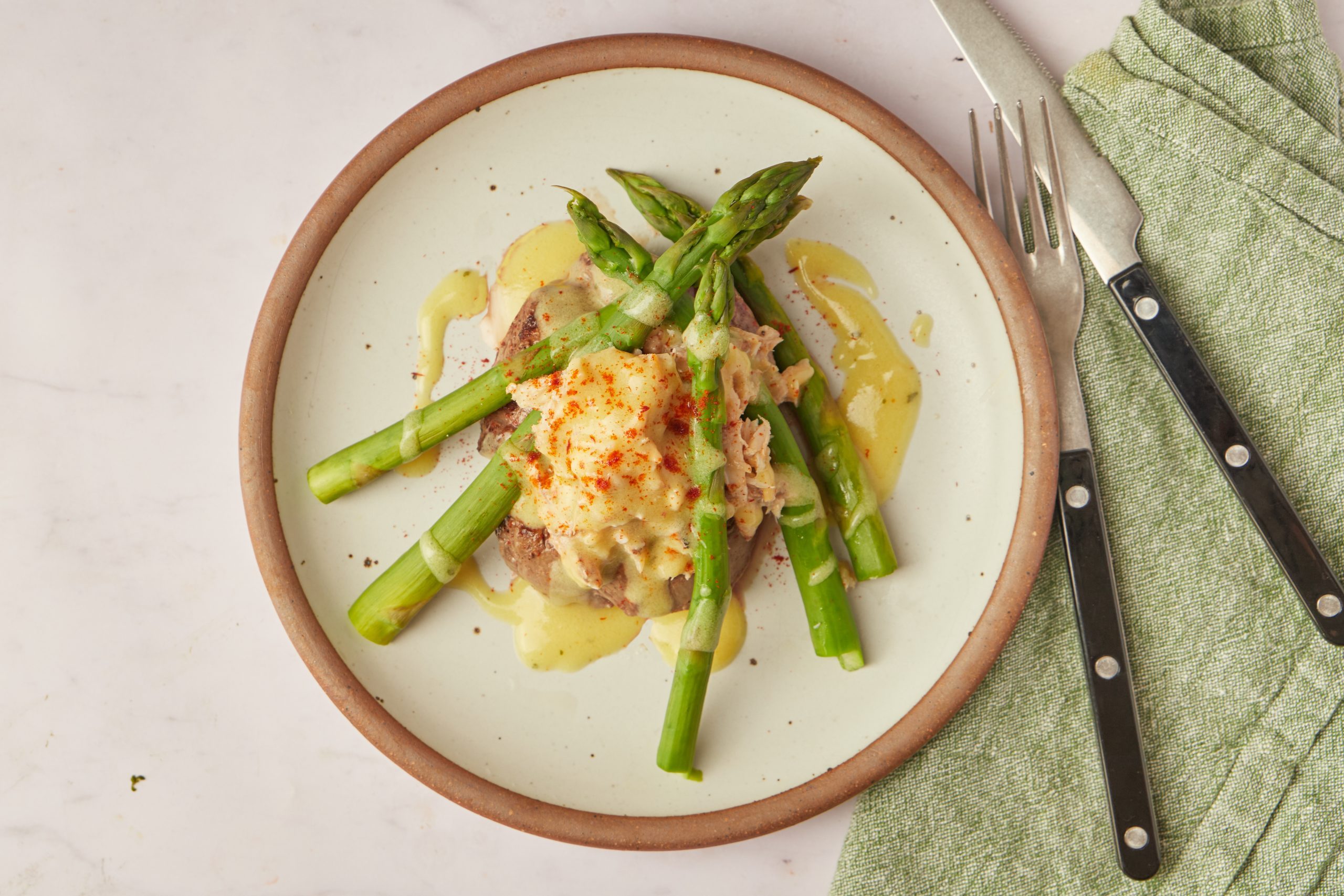 If you like surf 'n' turf, you'll love steak Oscar. It's an amped-up version of surf 'n' turf made with premium ingredients, and this version is quick and easy to make.