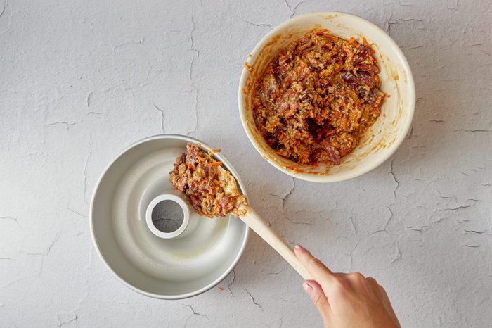 Transfer the plum pudding batter to the prepared pan.