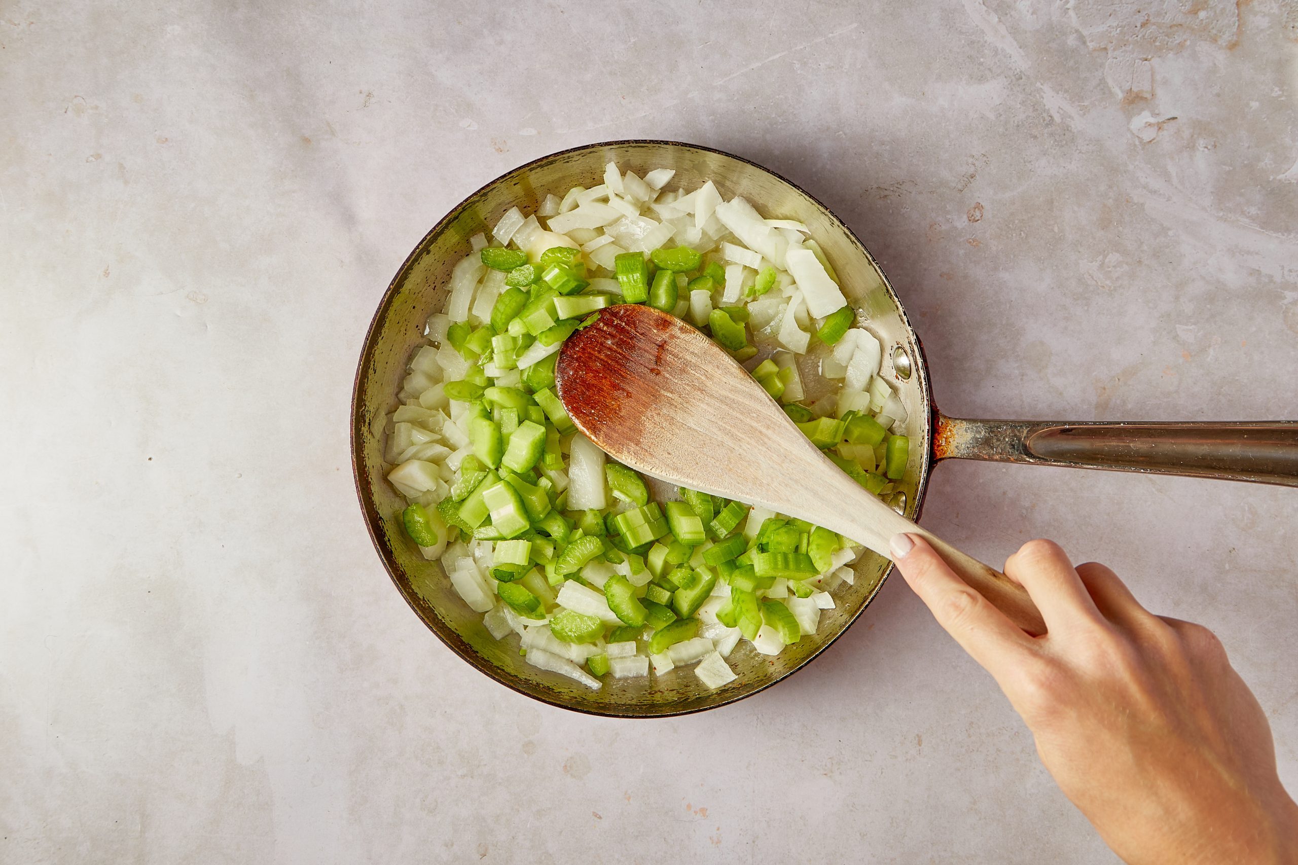 Cook the vegetables for the vegetarian crockpot stuffing.